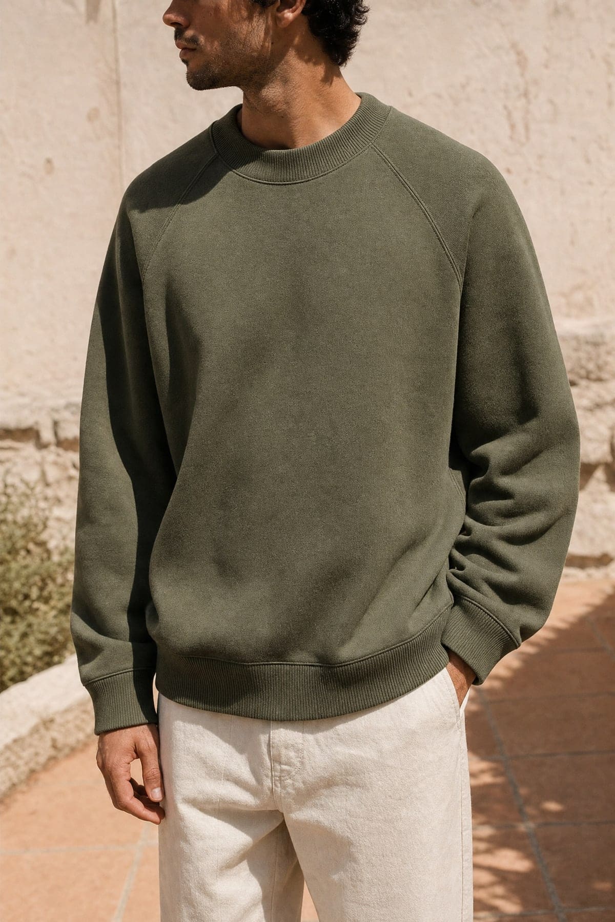 Crewneck in olive, worn outdoors